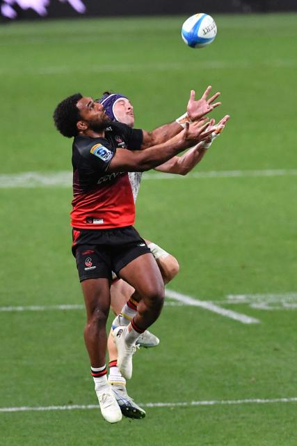 Crusaders' Sevu Reece (L) attempts to secure the ball during the Super Rugby Pacific match between the Crusaders and Chiefs at One New Zealand Stadium in Christchurch on May 22, 2026. (Photo by Sanka Vidanagama / AFP)
