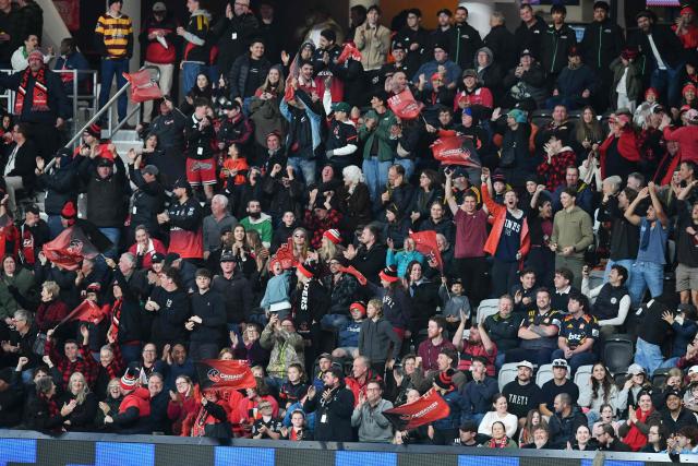 Fans cheer during the Super Rugby Pacific match between the Crusaders and Chiefs at One New Zealand Stadium in Christchurch on May 22, 2026. (Photo by Sanka Vidanagama / AFP)