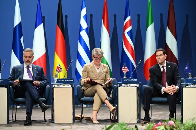 US Secretary of State Marco Rubio (R), Turkey's Foreign Minister Hakan Fidan  and Britain's Foreign Secretary Yvette Cooper (C) attend the NATO Foreign Ministers' meeting in Helsingborg, Sweden, on May 22, 2026. Foreign ministers of the 32 NATO member states gathered in the Swedish city to finalise preparations for the upcoming Ankara Summit. (Photo by Jonathan Nackstrand / AFP)
