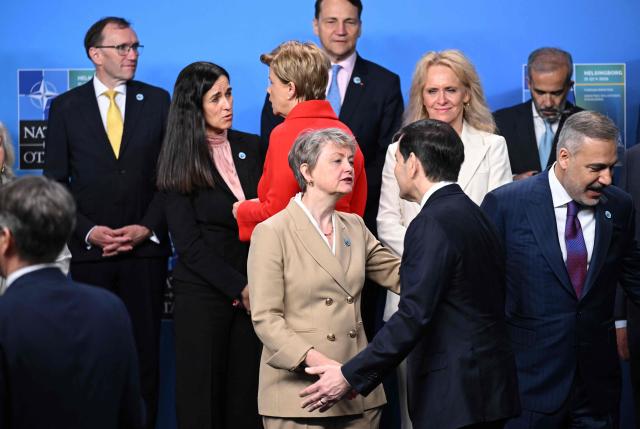 US Secretary of State Marco Rubio (C-R) greets British Foreign Secretary Yvette Cooper (C) as they prepare to pose for a family photo at the NATO Foreign Ministers' meeting in Helsingborg, Sweden, on May 22, 2026. Foreign ministers of the 32 NATO member states gathered in the Swedish city to finalise preparations for the upcoming Ankara Summit. (Photo by Jonathan Nackstrand / AFP)