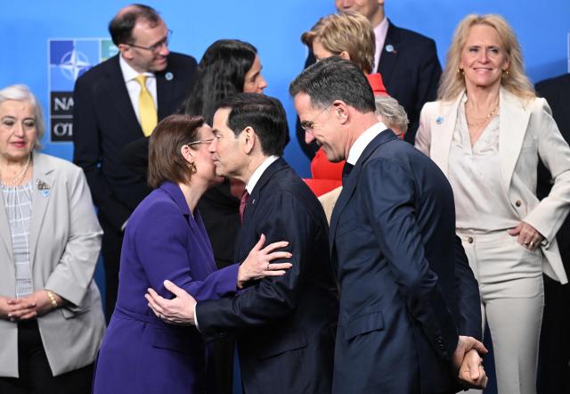 NATO Secretary General Mark Rutte (C-R) looks on as US Secretary of State Marco Rubio (C) greets Sweden's Foreign Minister Maria Malmer Stenergard (C-L) as they prepare to pose for a family photo at the NATO Foreign Ministers' meeting in Helsingborg, Sweden, on May 22, 2026. Foreign ministers of the 32 NATO member states gathered in the Swedish city to finalise preparations for the upcoming Ankara Summit. (Photo by Jonathan Nackstrand / AFP)