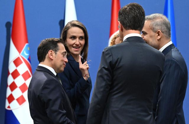 (L-R) Spain's Foreign Minister Jose Manuel Albares Bueno, Romania's Foreign Minister Oana-Silvia Toiu, NATO Secretary General Mark Rutte and Turkish Foreign Minister Hakan Fidan talk at the NATO Foreign Ministers' meeting in Helsingborg, Sweden, on May 22, 2026. Foreign ministers of the 32 NATO member states gathered in the Swedish city to finalise preparations for the upcoming Ankara Summit. (Photo by Jonathan Nackstrand / AFP)