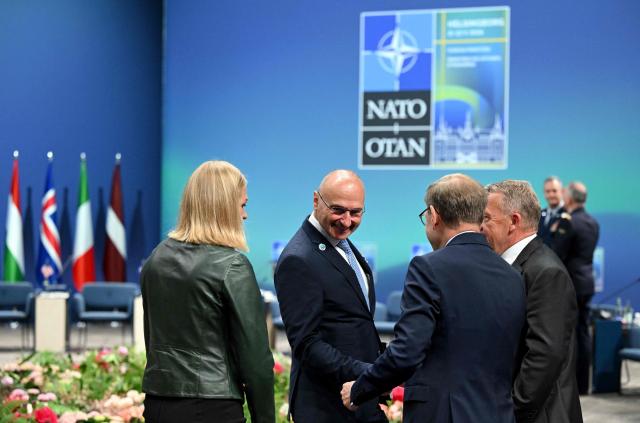 (L-R) Finland's Foreign Minister Elina Valtonen, Croatia's Foreign Minister Gordan Grlic Radman, German Foreign Minister Johann Wadephul and Denmark's Foreign Minister Lars Loekke Rasmussen talk at the NATO Foreign Ministers' meeting in Helsingborg, Sweden, on May 22, 2026. Foreign ministers of the 32 NATO member states gathered in the Swedish city to finalise preparations for the upcoming Ankara Summit. (Photo by Jonathan Nackstrand / AFP)
