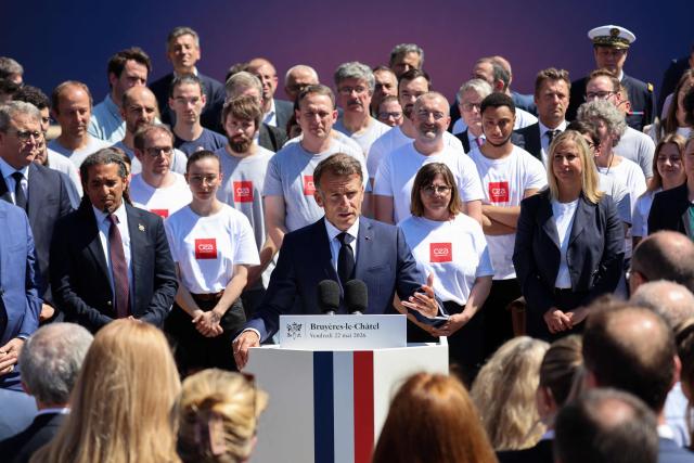France's President Emmanuel Macron (C) delivers a speech during the European Forum on Computing Power, Quantum Sciences and Technologies, and Semiconductors at the Very Large Computing Centre of the French Alternative Energies and Atomic Energy Commission (CEA) in Bruyeres-le-Châtel, south of Paris on May 22, 2026. (Photo by Ludovic MARIN / POOL / AFP)