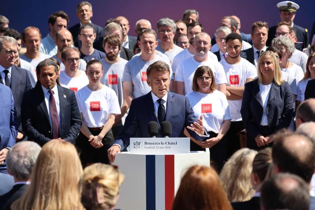 France's President Emmanuel Macron (C) gestures as he delivers a speech during the European Forum on Computing Power, Quantum Sciences and Technologies, and Semiconductors at the Very Large Computing Centre of the French Alternative Energies and Atomic Energy Commission (CEA) in Bruyeres-le-Châtel, south of Paris on May 22, 2026. (Photo by Ludovic MARIN / POOL / AFP)