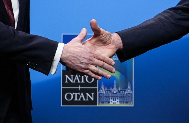 NATO Secretary General Mark Rutte (R) and US Secretary of State Marco Rubio shake hands after giving remarks at the NATO Foreign Ministers' meeting in Helsingborg, Sweden, on May 22, 2026. Foreign ministers of the 32 NATO member states gathered in the Swedish city to finalise preparations for the upcoming Ankara Summit. (Photo by Julia Demaree Nikhinson / POOL / AFP)