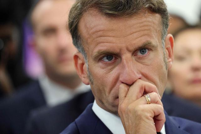 France's President Emmanuel Macron looks on during a visit to the European Forum on Computing Power, Quantum Sciences and Technologies, and Semiconductors at the Very Large Computing Centre of the French Alternative Energies and Atomic Energy Commission (CEA) in Bruyeres-le-Chatel, south of Paris on May 22, 2026. (Photo by Ludovic MARIN / POOL / AFP)