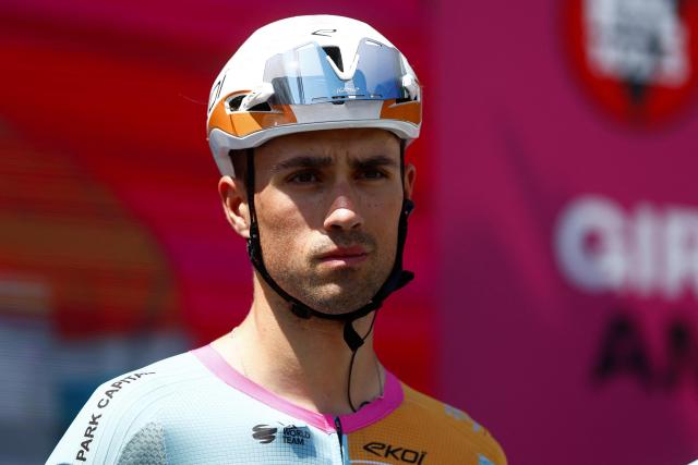 NSN Cycling Team British rider Ethan Vernon stands on stage before the start of the 13th stage of the Giro d'Italia 2026 - Tour of Italy cycling race between Alessandria and Verbania, Italy, on May 22, 2026. (Photo by Luca Bettini / AFP)