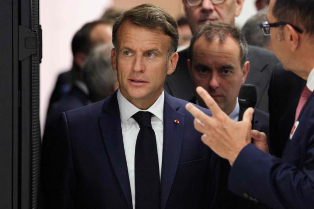 France's President Emmanuel Macron looks on during a visit to the European Forum on Computing Power, Quantum Sciences and Technologies, and Semiconductors at the Very Large Computing Centre of the French Alternative Energies and Atomic Energy Commission (CEA) in Bruyeres-le-Chatel, south of Paris on May 22, 2026. (Photo by Ludovic MARIN / POOL / AFP)
