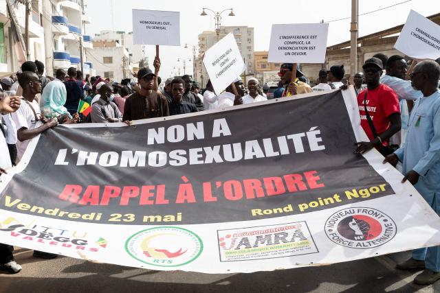 (FILES) Protesters hold a placard reading "No to homosexuality, call to order" during a demonstration calling for the criminalization of homosexuality in Senegal, in Dakar on May 23, 2025. Senegalese Prime Minister Ousmane Sonko on May 22, 2026 condemned Western "tyranny" in wanting to "impose" homosexuality and rejected any attempt to stop the application of a new law toughing sentences for same-sex relations. (Photo by SEYLLOU / AFP)