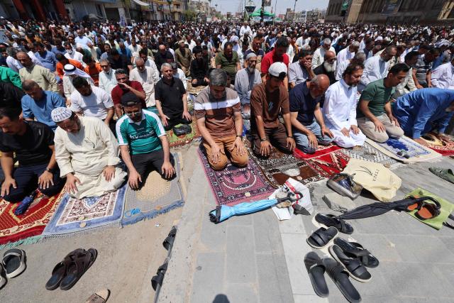 Supporters of Iraqi Shiite Muslim cleric Muqtada al-Sadr gather to perform weekly Friday prayers in Sadr City in eastern Baghdad on May 22, 2026. (Photo by AHMAD AL-RUBAYE / AFP)