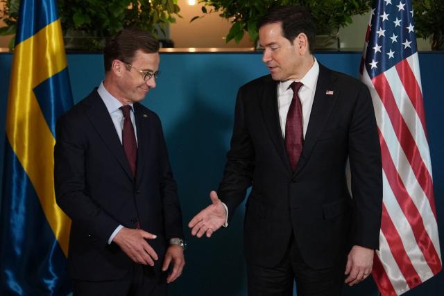 US Secretary of State Marco Rubio (R)  shakes hands with Sweden's Prime Minister Ulf Kristersson on the sidelines of the NATO Foreign Ministers' meeting in Helsingborg, Sweden, on May 22, 2026. Foreign ministers of the 32 NATO member states gathered in the Swedish city to finalise preparations for the upcoming Ankara Summit. (Photo by Julia Demaree Nikhinson / POOL / AFP)