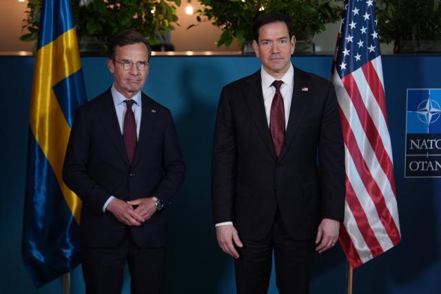 US Secretary of State Marco Rubio (R) poses with Sweden's Prime Minister Ulf Kristersson on the sidelines of the NATO Foreign Ministers' meeting in Helsingborg, Sweden, on May 22, 2026. Foreign ministers of the 32 NATO member states gathered in the Swedish city to finalise preparations for the upcoming Ankara Summit. (Photo by Julia Demaree Nikhinson / POOL / AFP)