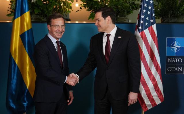 US Secretary of State Marco Rubio (R) shakes hands with Sweden's Prime Minister Ulf Kristersson on the sidelines of the NATO Foreign Ministers' meeting in Helsingborg, Sweden, on May 22, 2026. Foreign ministers of the 32 NATO member states gathered in the Swedish city to finalise preparations for the upcoming Ankara Summit. (Photo by Julia Demaree Nikhinson / POOL / AFP)