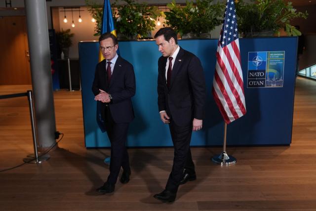 US Secretary of State Marco Rubio (R) walks with Sweden's Prime Minister Ulf Kristersson on the sidelines of the NATO Foreign Ministers' meeting in Helsingborg, Sweden, on May 22, 2026. Foreign ministers of the 32 NATO member states gathered in the Swedish city to finalise preparations for the upcoming Ankara Summit. (Photo by Julia Demaree Nikhinson / POOL / AFP)