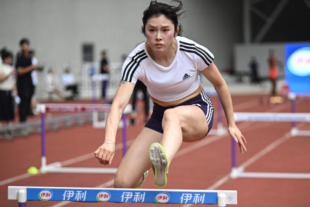 China's Wu Yanni trains one day ahead of the Diamond League Xiamen athletics meeting at Egret Stadium in Xiamen, in China’s eastern Fujian province on May 22, 2026. (Photo by Jade GAO / AFP)