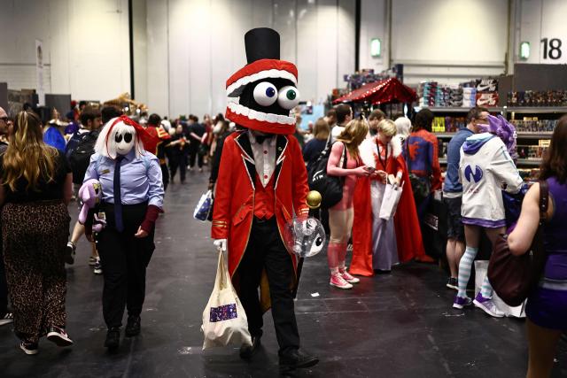 Cosplayers mingle during the MCM Comic Con at ExCeL exhibition centre in London on May 22, 2026. (Photo by Henry NICHOLLS / AFP)
