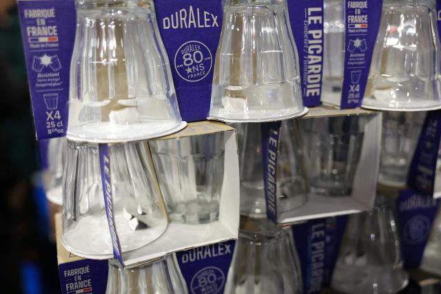 (FILES) This photograph shows boxes of Duralex glasses displayed during the 'Made in France' trade fair in Porte de Versailles, in Paris on November 7, 2025. A state-ordered audit is underway at Duralex, a globally renowned glassware company that was taken over as a cooperative by its employees, due to a "tight" cash flow situation, the AFP learned on May 22, 2026 from Bercy, confirming a report by France Inter. (Photo by Thomas SAMSON / AFP)