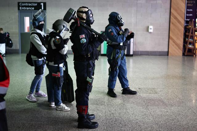 Cosplayers arrive for the MCM Comic Con at ExCeL exhibition centre in London on May 22, 2026. (Photo by Henry NICHOLLS / AFP)
