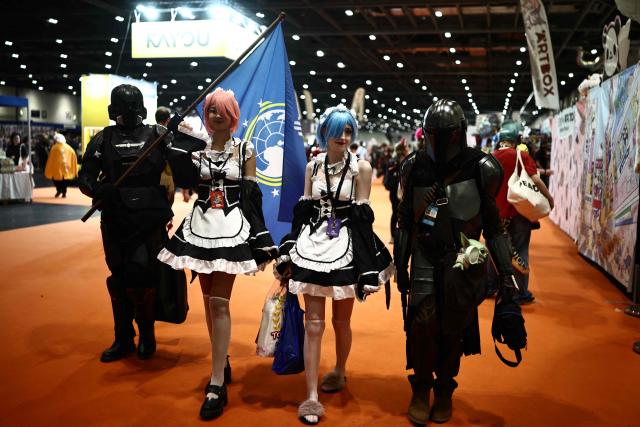 Cosplayers mingle during the MCM Comic Con at ExCeL exhibition centre in London on May 22, 2026. (Photo by Henry NICHOLLS / AFP)
