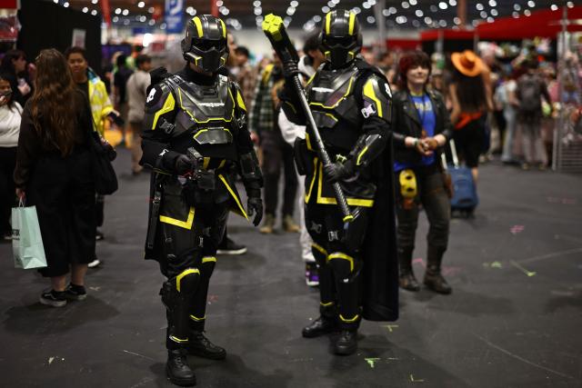 Cosplayers pose for a photo during the MCM Comic Con at ExCeL exhibition centre in London on May 22, 2026. (Photo by Henry Nicholls / AFP)