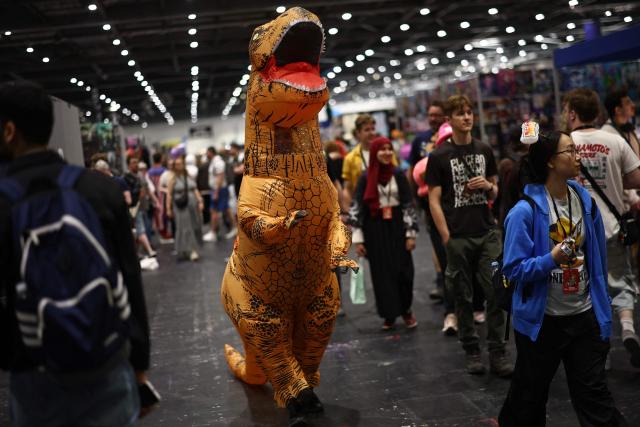 Cosplayers mingle during the MCM Comic Con at ExCeL exhibition centre in London on May 22, 2026. (Photo by Henry Nicholls / AFP)
