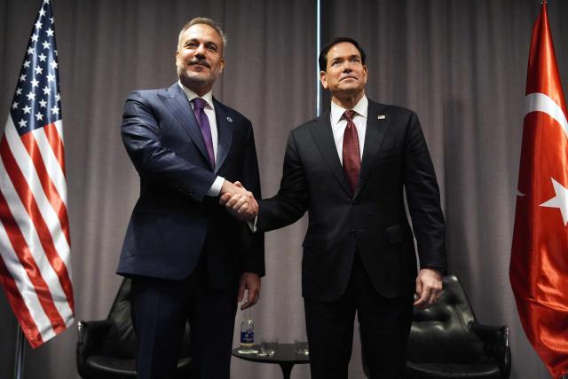 United States Secretary of State Marco Rubio (R) shakes hands with Turkish Foreign Minister Hakan Fidan as they meet on the sidelines of the NATO Foreign Ministers' meeting in Helsingborg, Sweden, on May 22, 2026. Foreign ministers of the 32 NATO member states gathered in the Swedish city to finalise preparations for the upcoming Ankara Summit. (Photo by Julia Demaree Nikhinson / POOL / AFP)