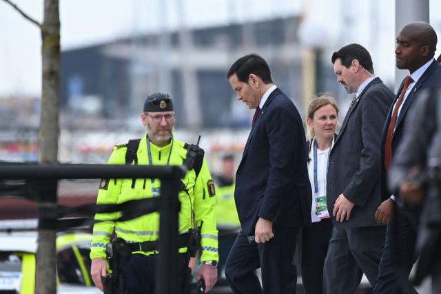 US Secretary of State Marco Rubio (L) leaves after the NATO Foreign Ministers' meeting in Helsingborg, Sweden, on May 22, 2026. Foreign ministers of the 32 NATO member states gathered in the Swedish city to finalise preparations for the upcoming Ankara Summit. (Photo by Jonathan Nackstrand / AFP)