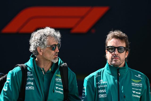 Aston Martin's Spanish driver Fernando Alonso (R) arrives ahead of a practice session for the 2026 Formula 1 Grand Prix du Canada at Circuit Gilles-Villeneuve in Montreal, Canada, on May 22, 2026. (Photo by Andrej Ivanov / AFP)