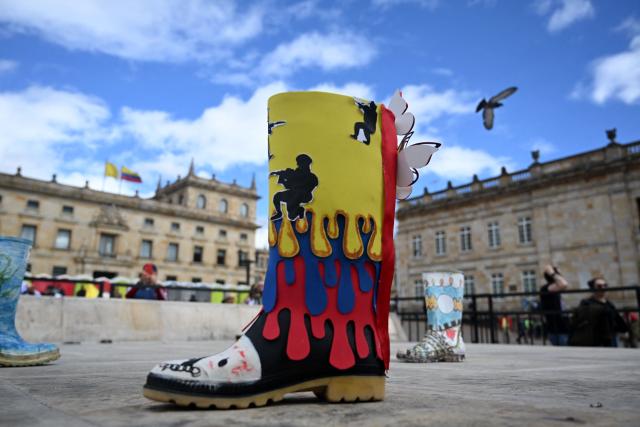 An art installation paying tribute to victims of so-called "false positives," a term used in Colombia for extrajudicial killings, is seen at Plaza Bolivar in Bogota on May 22, 2026, ahead of a campaign rally by Colombia's presidential candidate Ivan Cepeda. (Photo by Raul ARBOLEDA / AFP)