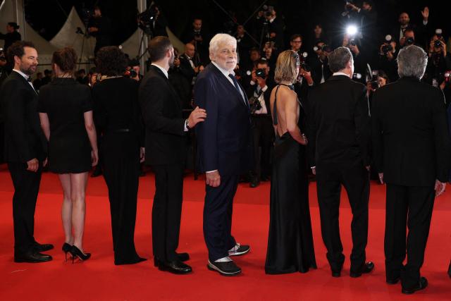 French actor Jacques Weber (C) arrives with cast members for the screening of the film "L'Objet du delit" (Crescendo) at the 79th edition of the Cannes Film Festival in Cannes, southern France on May 22, 2026. (Photo by Sameer AL-DOUMY / AFP)