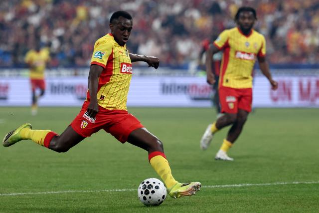 Lens' Saudi Arabian defender #23 Saud Abdulhamid shoots the ball during the French Cup final football match between RC Lens and OGC Nice at the Stade de France stadium, in Saint-Denis, on the outskirts of Paris, on May 22, 2026. (Photo by FRANCK FIFE / AFP)