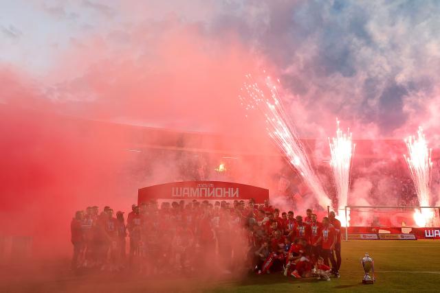 FK Crvena Zvezda (Red Star) players celebrate their Serbian SuperLiga and Serbian Cup trophies at the Rajko Mitic Stadium in Belgrade on May 22, 2026, before their SuperLiga match against OFK Belgrade. (Photo by Pedja Milosavljevic / AFP)