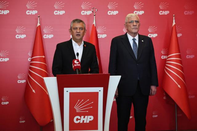 Leader of Republican People's Party (CHP) Ozgur Ozel addresses a press conference, next to Leader of IYI Party Dursun Müsavat Dervi?o?lu (R), on the sidelines of a protest against allegations of vote buying at the CHP congress in November 2023, at the party headquarters in Ankara, on May 22, 2026. An Ankara court on May 21, 2026 annulled the 2023 leadership election of Turkey's main opposition CHP party, state news agency Anadolu reported, in a sharp escalation against the country's embattled opposition. The ruling overturns the result of the leadership election that brought in current party head Ozgur Ozel -- and ordered that the party's former longterm chair, Kemal Kilicdaroglu -- who lost the election to Ozel -- take over as interim leader. (Photo by Adem ALTAN / AFP)