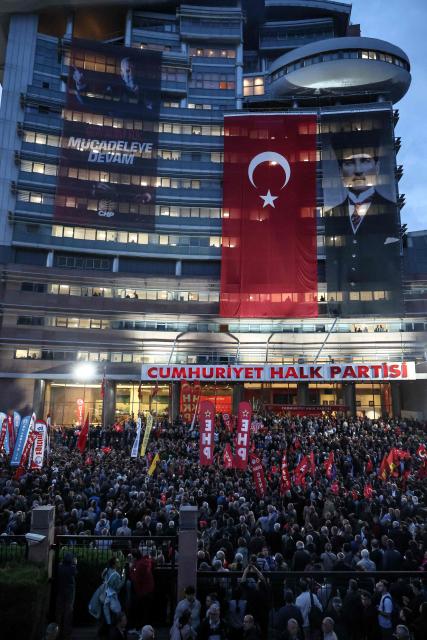 Supporters gather during a protest attended by the leader of Republican People's Party (CHP) Ozgur Ozel against allegations of vote buying at the CHP congress in November 2023, at their party headquarters in Ankara on May 22, 2026. An Ankara court on May 21 annulled the 2023 leadership election of Turkey's main opposition CHP party, state news agency Anadolu reported, in a sharp escalation against the country's embattled opposition. The ruling overturns the result of the leadership election that brought in current party head Ozgur Ozel -- and ordered that the party's former longterm chair, Kemal Kilicdaroglu -- who lost the election to Ozel -- take over as interim leader. (Photo by ADEM ALTAN / AFP)