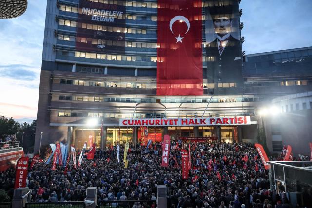 Supporters gather during a protest attended by the leader of Republican People's Party (CHP) Ozgur Ozel against allegations of vote buying at the CHP congress in November 2023, at their party headquarters in Ankara on May 22, 2026. An Ankara court on May 21 annulled the 2023 leadership election of Turkey's main opposition CHP party, state news agency Anadolu reported, in a sharp escalation against the country's embattled opposition. The ruling overturns the result of the leadership election that brought in current party head Ozgur Ozel -- and ordered that the party's former longterm chair, Kemal Kilicdaroglu -- who lost the election to Ozel -- take over as interim leader. (Photo by ADEM ALTAN / AFP)