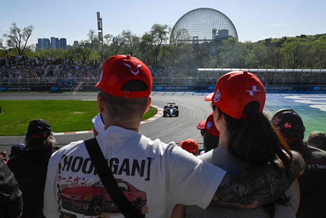 Spectators watch as Williams' Spanish driver Carlos Sainz races during the qualifying session for the Sprint race ahead of the 2026 Formula 1 Grand Prix du Canada at Circuit Gilles-Villeneuve in Montreal, Canada, on May 22, 2026. (Photo by Andrej Ivanov / AFP)