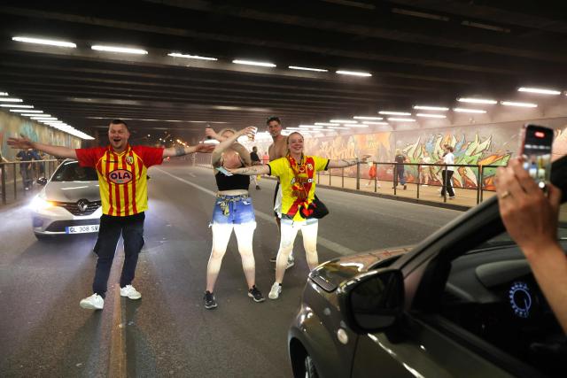 RC Lens supporters celebrate in the streets after their team’s victory over OGC Nice in the French Cup final, in Lens, northern France, on May 22, 2026. (Photo by Francois LO PRESTI / AFP)
