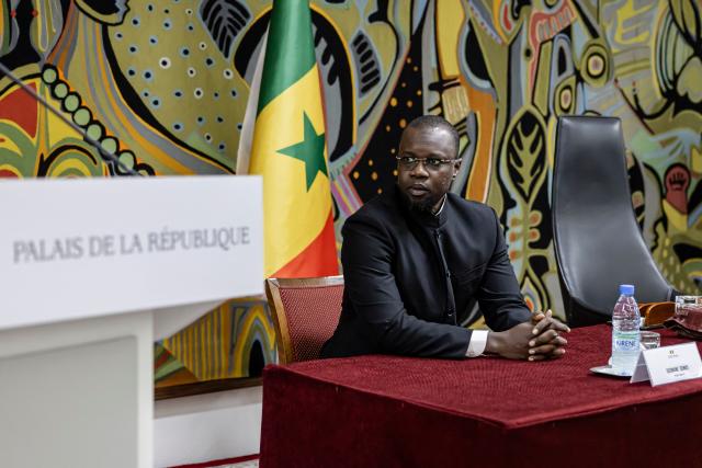 (FILES) Senegal Prime Minister Ousmane Sonko awaits the arrival of Senegal President Bassirou Diomaye Faye ahead of receiving the official report on the Thiaroye massacre during a ceremony at the Presidential Palace in Dakar, on October 16, 2025. Senegal President Bassirou Diomaye Faye on Friday sacked Prime Minister Ousmane Sonko and dissolved the government after months of tensions, deepening a crisis in the debt-laden west African nation.
The shock announcement was made on state television in a decree read out by presidential aide Oumar Samba Ba, who said Faye "has ended the duties of Ousmane Sonko...  and consequently those of the ministers and secretaries of state who are members of the government". (Photo by PATRICK MEINHARDT / AFP)
