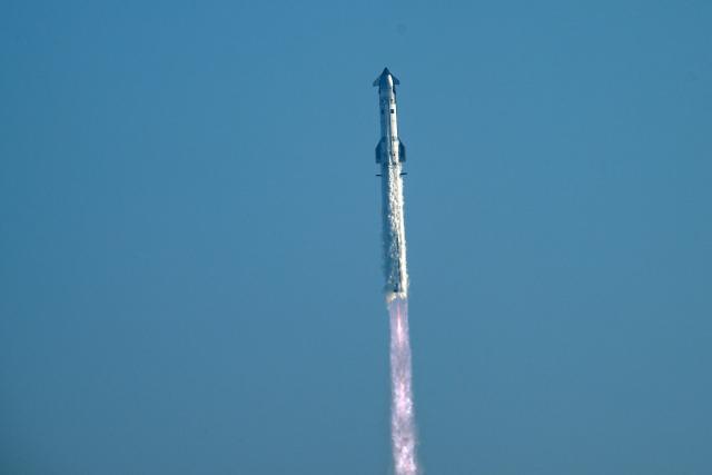 SpaceX's Starship 39 rocket launches from Starbase during the 12th test flight as seen from South Padre Island, Texas, on May 22, 2026. Elon Musk's SpaceX on May 22 launched its latest Starship, sending the mammoth rocket soaring into the Texas skies after its initial attempt was scrubbed due to technical issues. The Starship spacecraft and Super Heavy rocket booster appeared to separate as expected, but the company's spokesperson Dan Huot said on the livestream that the booster did not complete a burn necessary to steer itself to a controlled landing, meaning it likely can't make a precision touchdown as hoped. (Photo by RONALDO SCHEMIDT / AFP)