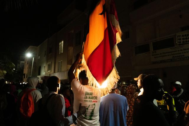 Supporters of Ousmane Sonko gather to protest in front of his house in Dakar on May 22, 2026 following his dismissal as Senegal's prime minister. Senegal President Bassirou Diomaye Faye on May 22 sacked Prime Minister Ousmane Sonko and dissolved the government after months of tensions, deepening a crisis in the debt-laden west African nation. The shock announcement was made on state television in a decree read out by presidential aide Oumar Samba Ba, who said Faye "has ended the duties of Ousmane Sonko...  and consequently those of the ministers and secretaries of state who are members of the government". (Photo by SEYLLOU / AFP)