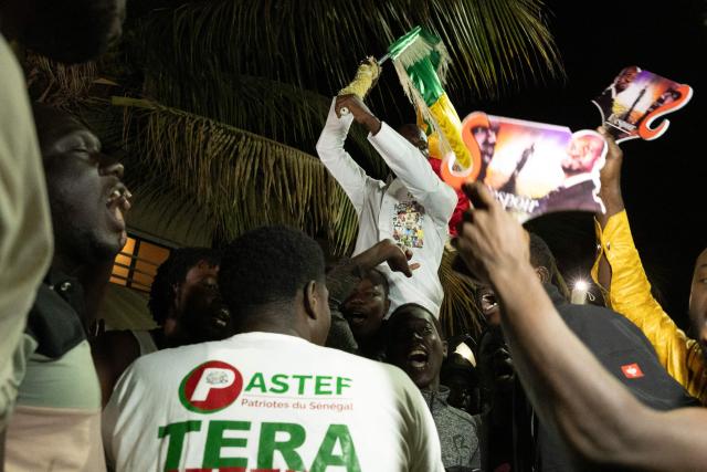 Supporters of Ousmane Sonko gather to protest in front of his house in Dakar on May 22, 2026 following his dismissal as Senegal's prime minister. Senegal President Bassirou Diomaye Faye on May 22 sacked Prime Minister Ousmane Sonko and dissolved the government after months of tensions, deepening a crisis in the debt-laden west African nation. The shock announcement was made on state television in a decree read out by presidential aide Oumar Samba Ba, who said Faye "has ended the duties of Ousmane Sonko...  and consequently those of the ministers and secretaries of state who are members of the government". (Photo by SEYLLOU / AFP)