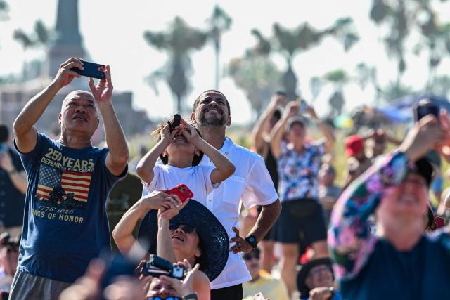 People watch the launch of SpaceX's Starship 39 rocket from Starbase as they gather in South Padre Island, Texas, on May 22, 2026. Elon Musk's SpaceX on May 22 launched its latest Starship, sending the mammoth rocket soaring into the Texas skies after its initial attempt was scrubbed due to technical issues. The Starship spacecraft and Super Heavy rocket booster appeared to separate as expected, but the company's spokesperson Dan Huot said on the livestream that the booster did not complete a burn necessary to steer itself to a controlled landing, meaning it likely can't make a precision touchdown as hoped. (Photo by RONALDO SCHEMIDT / AFP)