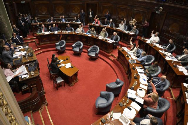 (FILES) Senators vote on a euthanasia bill at the Legislative Palace in Montevideo on October 15, 2025. A cancer patient became the first person to die by euthanasia in Uruguay on May 22, 2026, a country that passed a pioneering law in Latin America last year, a source from the Medical Association confirmed to AFP. (Photo by Santiago MAZZAROVICH / AFP)