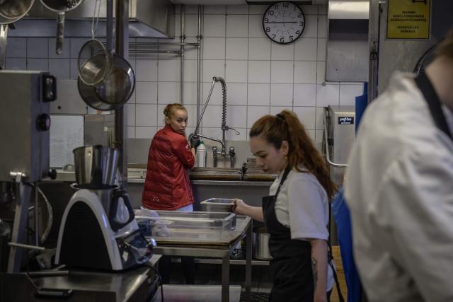 Workers from Asia work in the kitchen of a prestigious restaurant in Ilulissat, Greenland, on March 19, 2026. Around 1,200 Filipinos are settled in Greenland, which has 57,000 inhabitants, making them the largest foreign diaspora in this Danish territory. According to Greenland’s employers’ organisations, 5 to 6% of workers in the Arctic territory are now Asian, drawn by expanding sectors such as tourism. (Photo by Florent VERGNES / AFP)