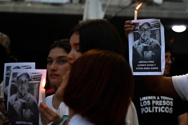 Relatives of political prisoners take part in a vigil in Caracas on May 22, 2026. Venezuela's interim president, Delcy Rodrнguez, said on May 22 that the release of political prisoners will exceed 500 “in the coming hours,” as she announced during an official broadcast. (Photo by Maryorin Mendez / AFP)