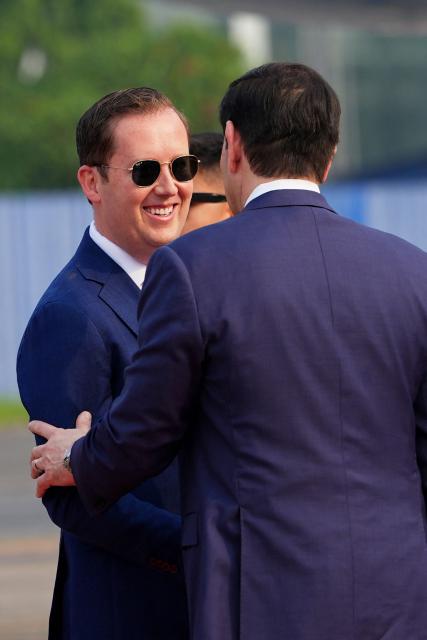 US Secretary of State Marco Rubio is greeted by the US Ambassador to India Sergio Gor (L) at Netaji Subhash Chandra Bose International Airport in Kolkata on May 23, 2026. Rubio arrived May 23 on his first trip to India where he will meet Prime Minister Narendra Modi on the heels of US diplomacy with China. (Photo by Julia Demaree Nikhinson / POOL / AFP)
