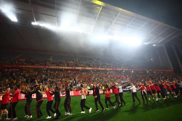 Members of Lens RC celebrate after Lens RC won the French Cup final football match against Nice OGC in Lens, northern France, on May 22, 2026. (Photo by FRANCK FIFE / AFP)