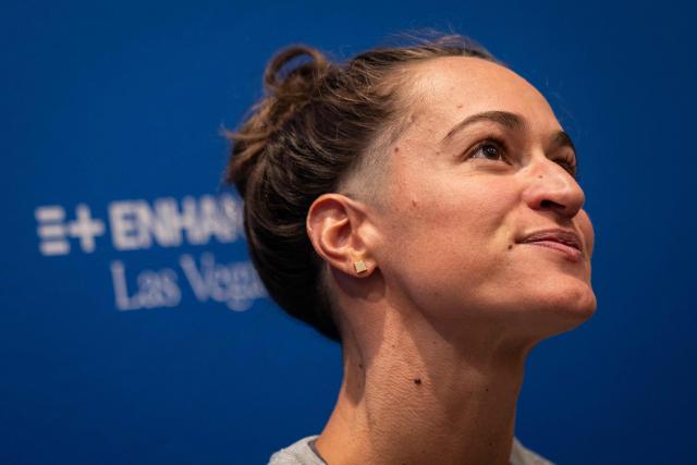 US swimmer, Megan Romano, talks with the press ahead of the Enhanced Games at the Resorts World in Las Vegas, Nevada, on May 22, 2026. The Enhanced Games is a multi-sport event that allows athletes to use performance-enhancing substances without worry of drug tests. (Photo by ETIENNE LAURENT / AFP)