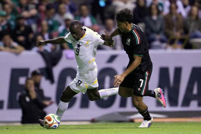 Ghana's forward #09 Felix Afena-Gyan and Mexico's defender #07 Luis Romo fight for the ball during a friendly football match between Mexico and Ghana at the Cuauhtemoc Stadium in Puebla, Mexico, on May 22, 2026. (Photo by Alfredo ESTRELLA / AFP)